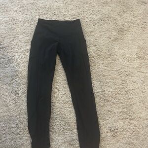 Black leggings with mesh detail on sides of legs